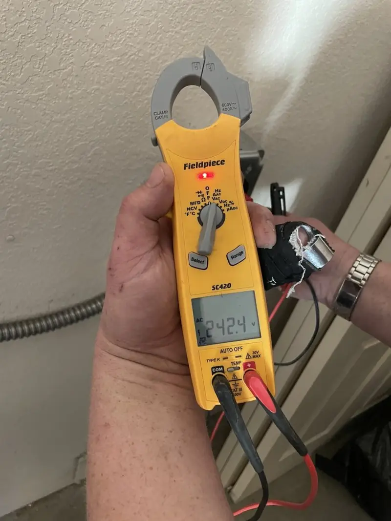 Voltage testing with clamp meter during Electrical Installation Services in Larkin